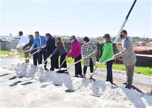 Former and current board members with shovels 